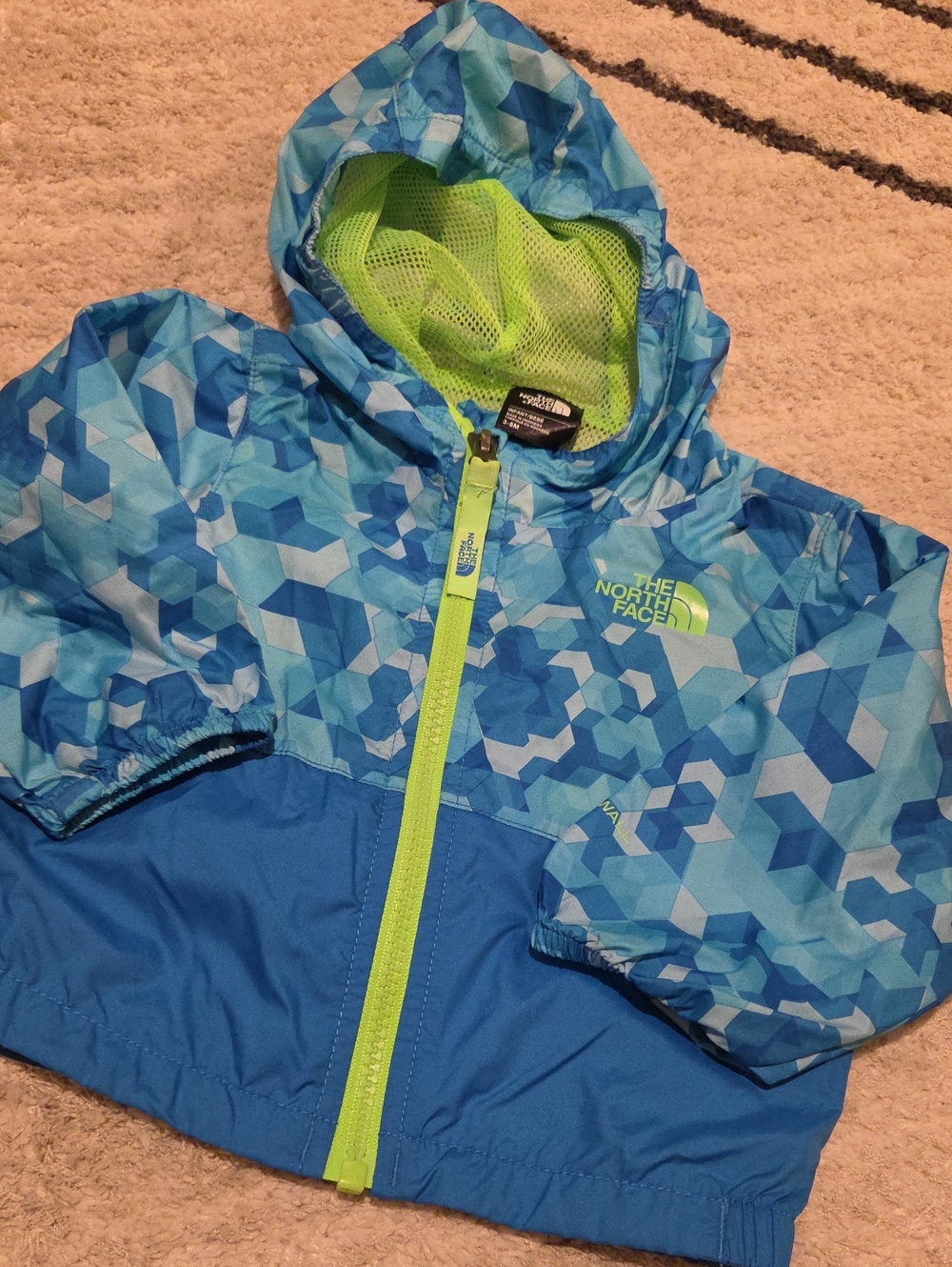 The North Face Kids Blue Geometric Hooded Rain Jacket with Neon Green Trim